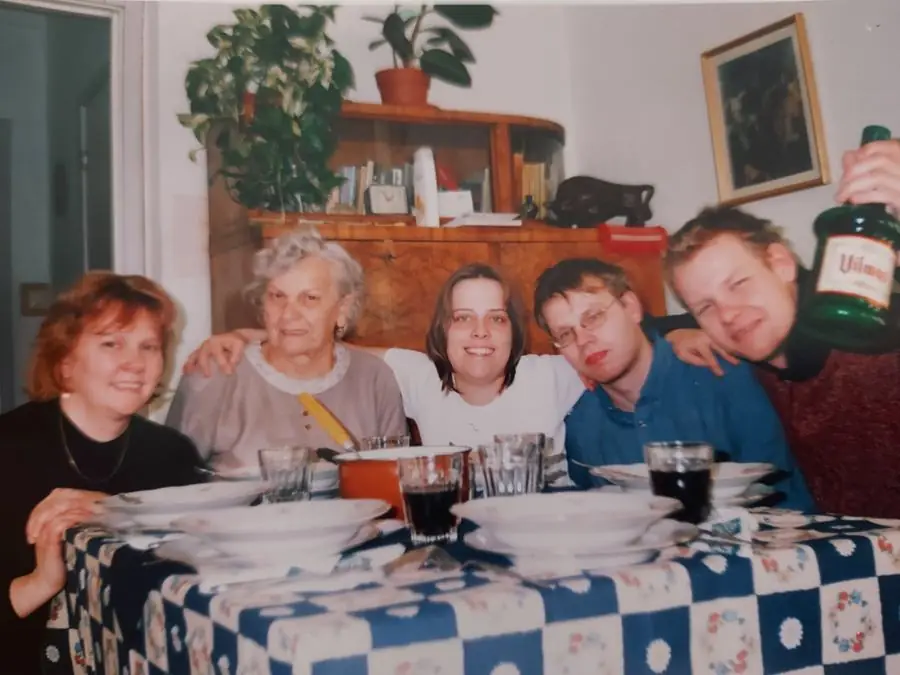 Grandma with family around a lunch table